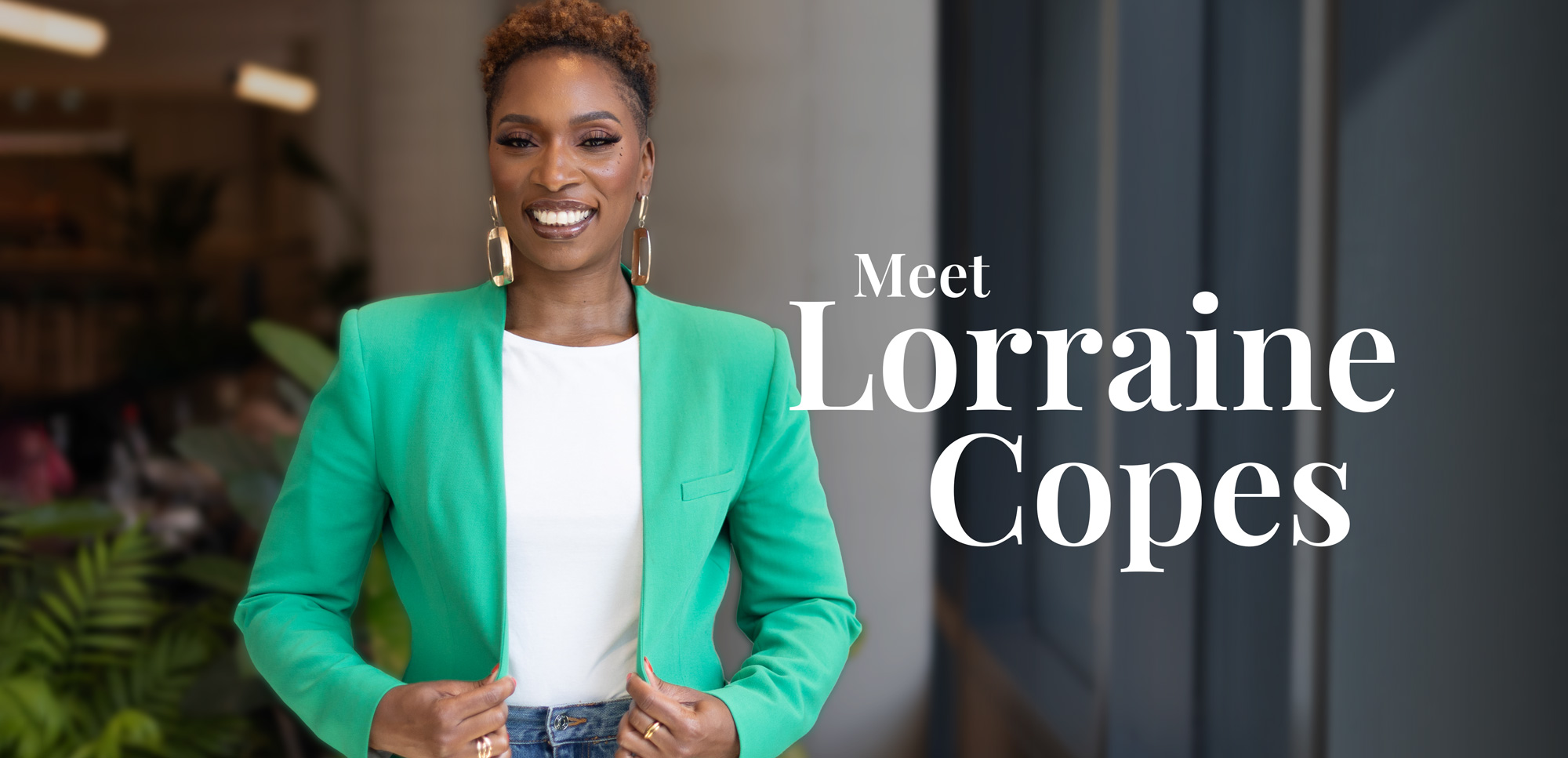 Lorraine Copes smiling in a green blazer with the text ‘Meet Lorraine Copes’ overlayed, representing her professional introduction.